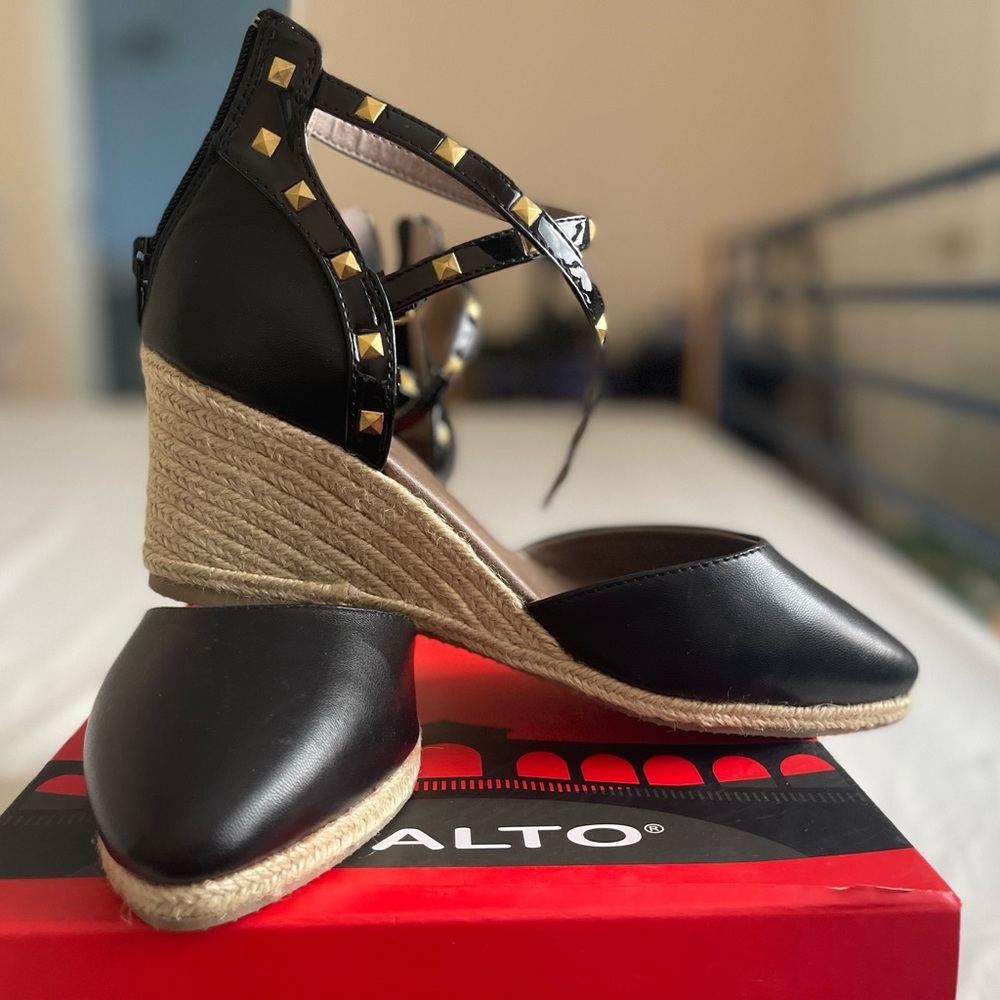 Black and tan wedges with double studded ankle straps, back zips.